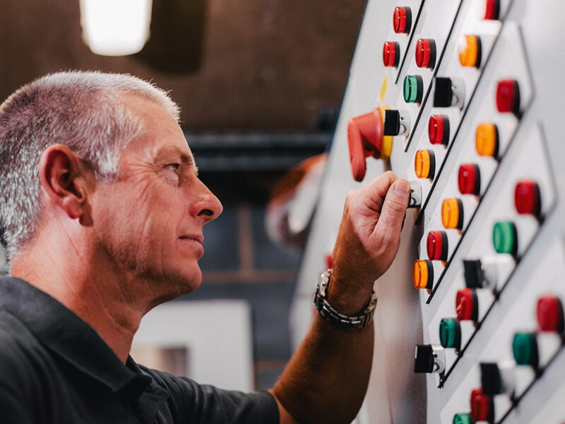 Engineer examining control panel